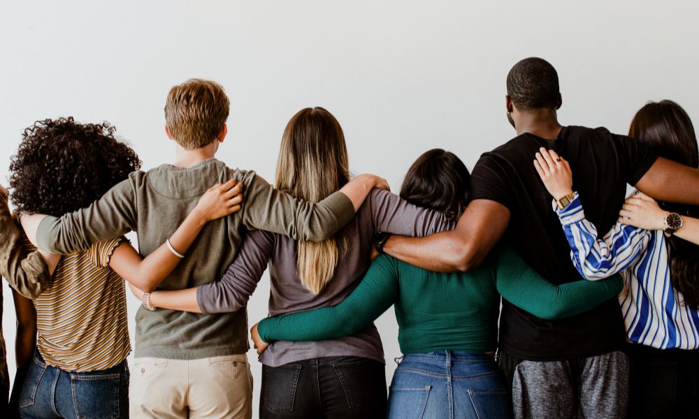 inclusive marketing group diverse people hugging